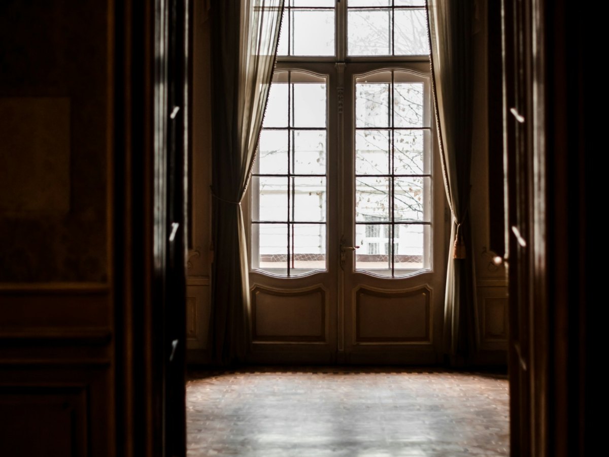 Pair of French doors with true divided lites in a chateau room