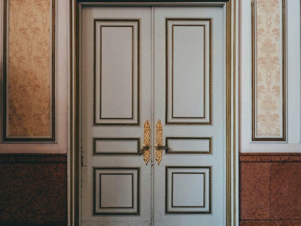 Classic French double door with gilded moldings