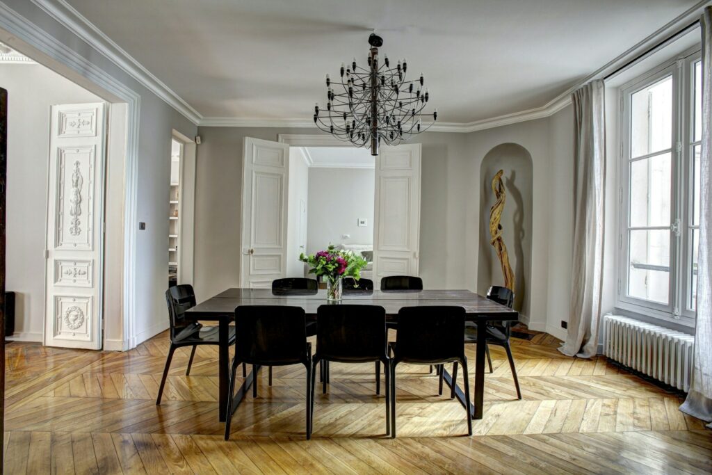 Classic French paneled double doors in a Parisian dining room